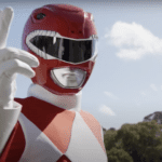 The Red Ranger from Mighty Mophpin Power Rangers standing in a powerful pose, wearing his signature red spandex suit with white diamond patterns, white gloves, and a helmet with a T-Rex design.